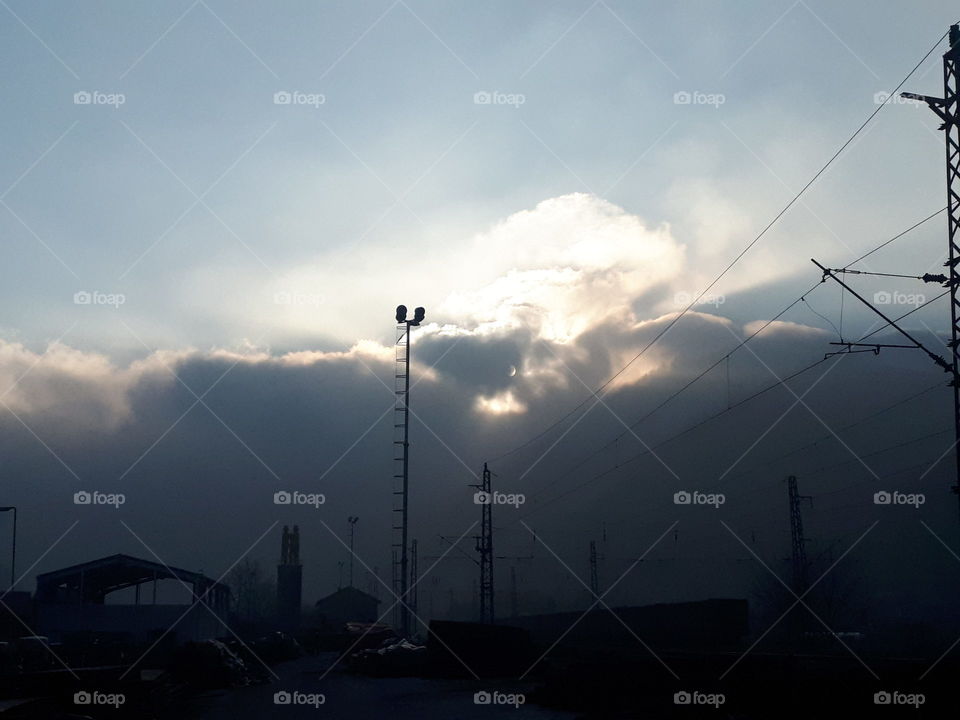 fog on the hill hides the sun and everything looks like an eclipse
