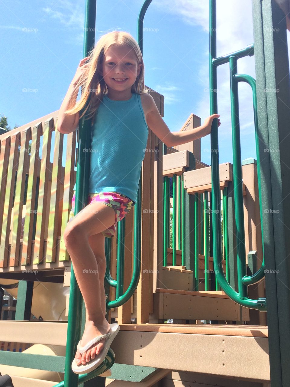 Little girl playing on a playground 