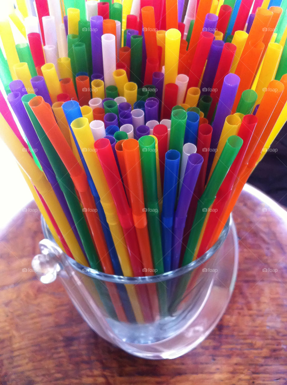 Multicolored straws in a backet