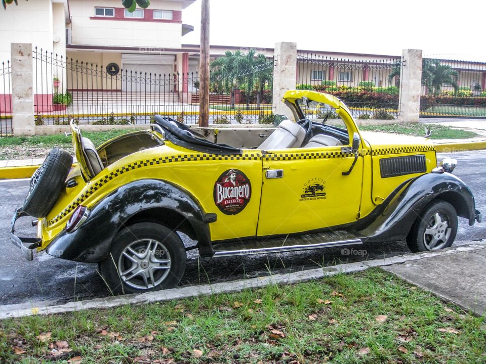 Yellow car in Cuba