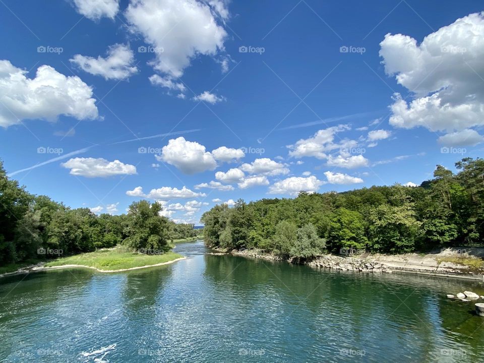 water landscape grass and clouds