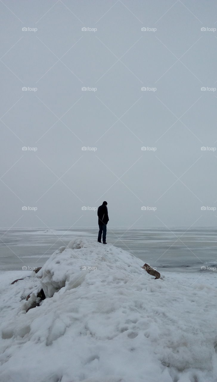 Man on a frozen land