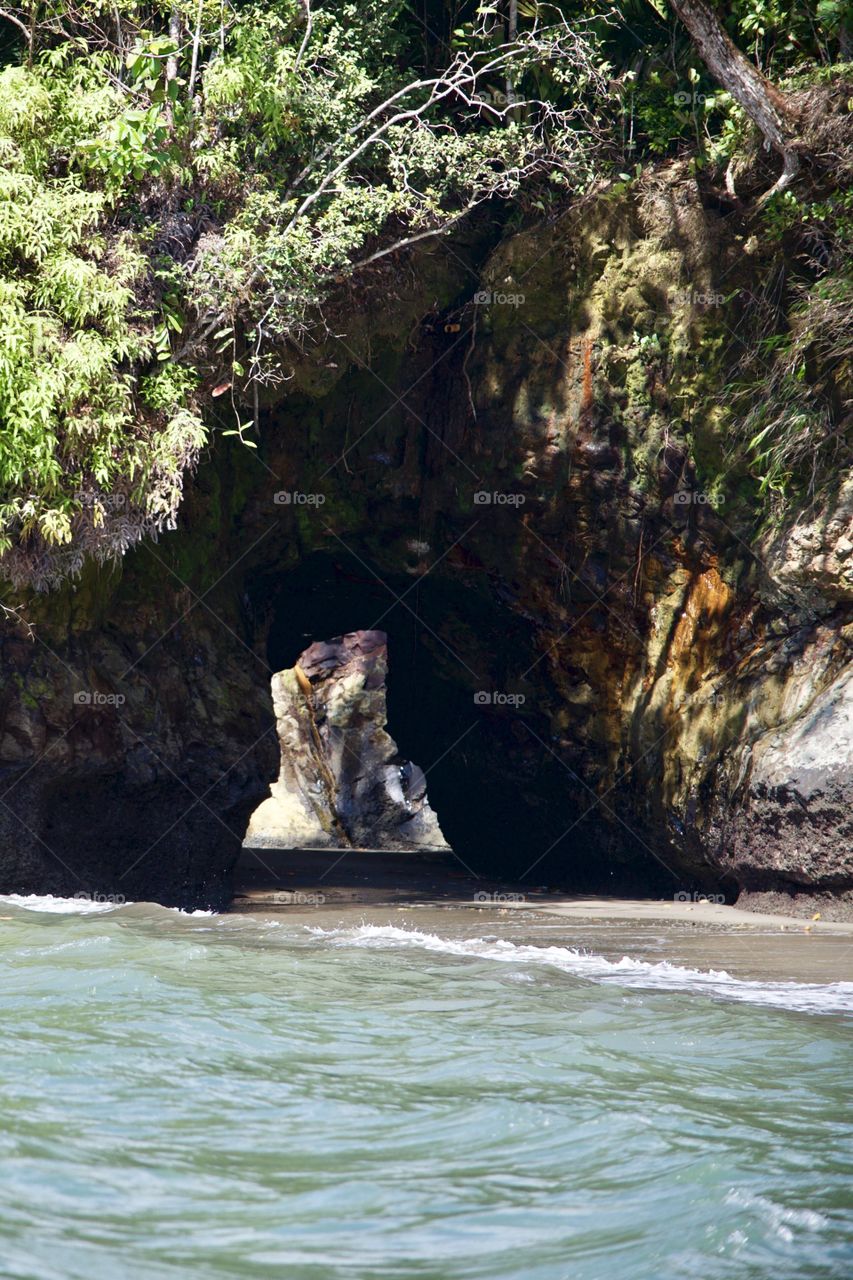 View of cave in front of sea