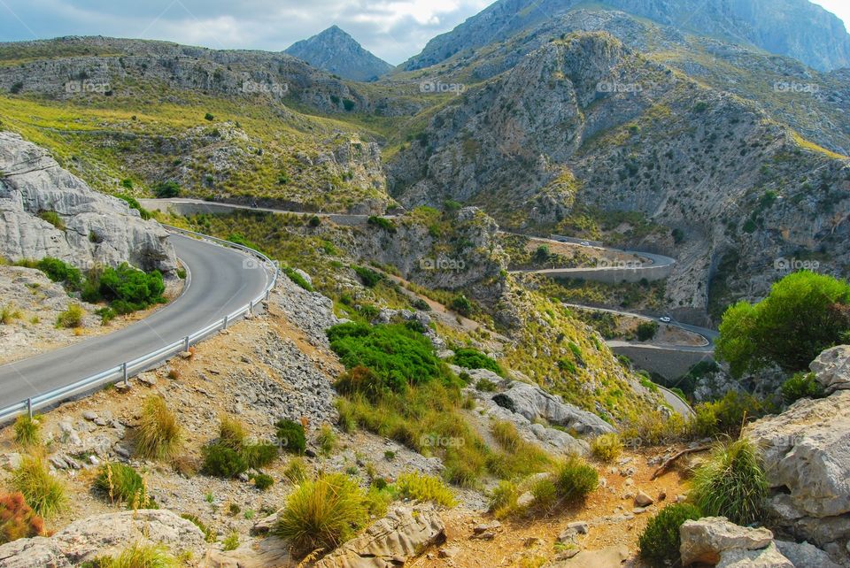 Winding road in valley, Majorca, Spain