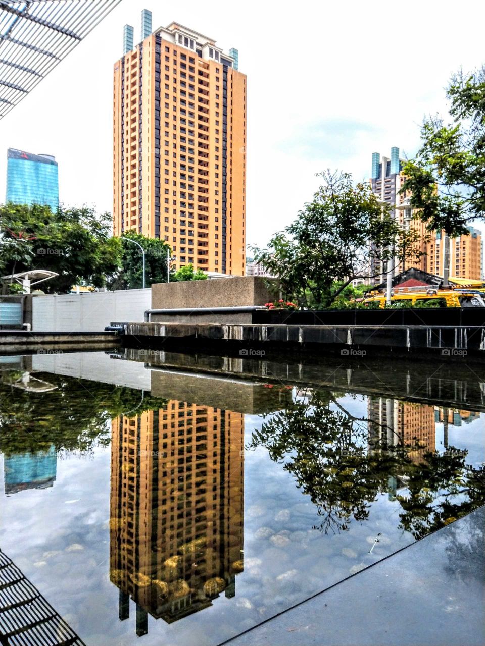 The art of composition: citycape. reflection of pool water.