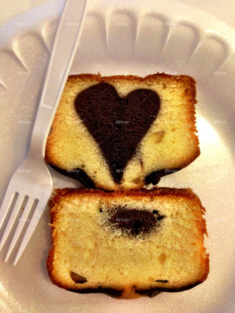 Piece of cake with heart chocolate shape