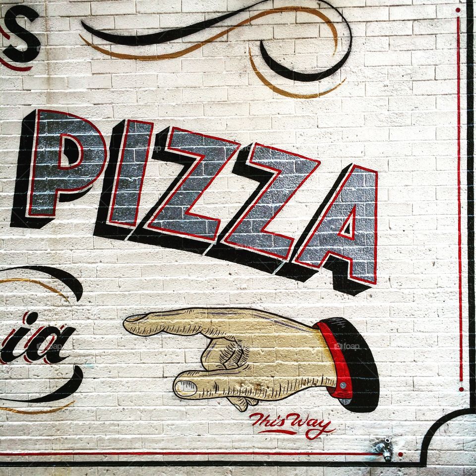 This way. Pizza sign