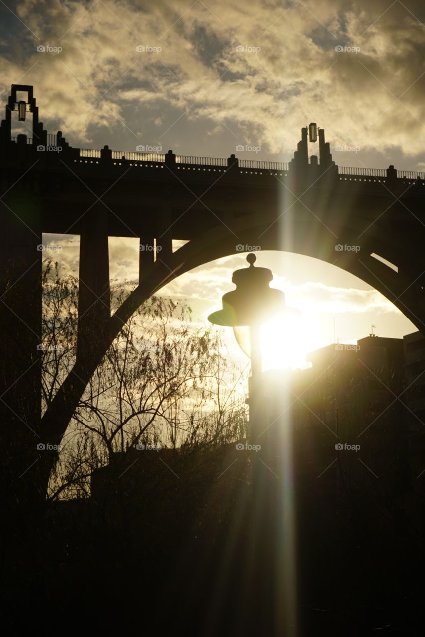 Bridge#sunset#lamp#sky#clouds#tree#rays