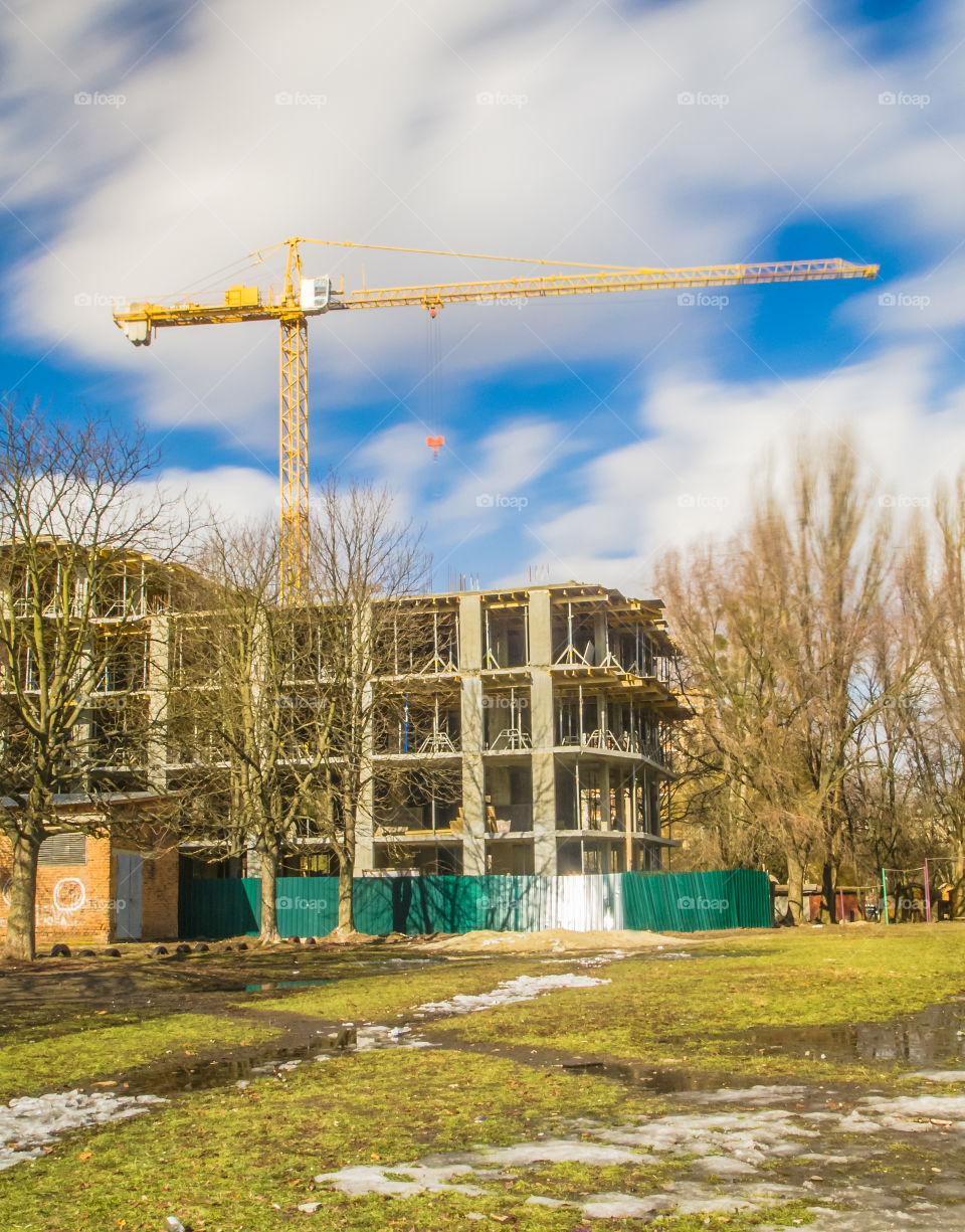 building process with crane on long exposure