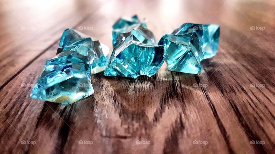 Blue gemstone on wood