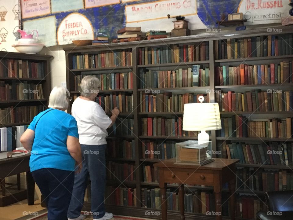 Next door at the museum looking at the library two from the group also taking a gander.