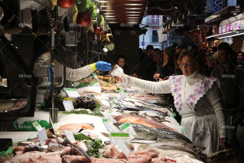 In the market woman buying fish 