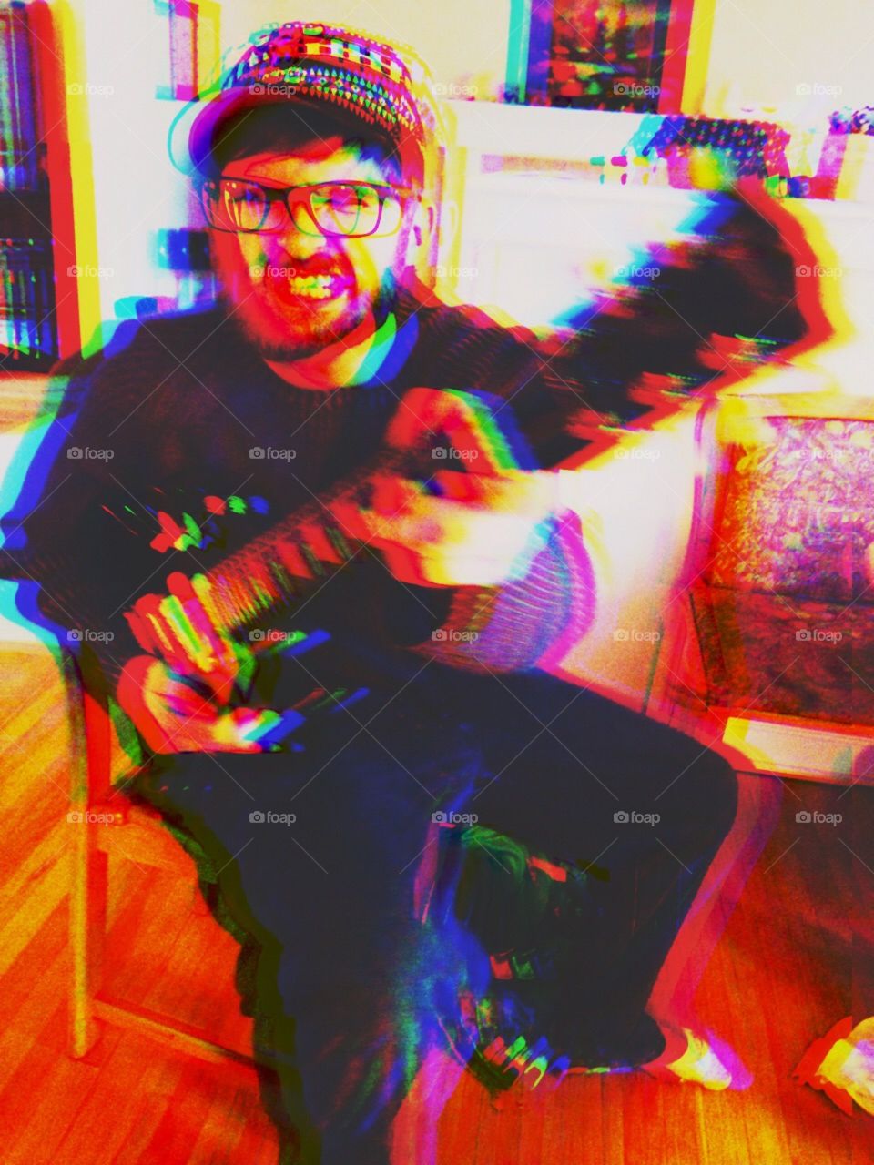 Man playing guitar with a psychedelic effect
