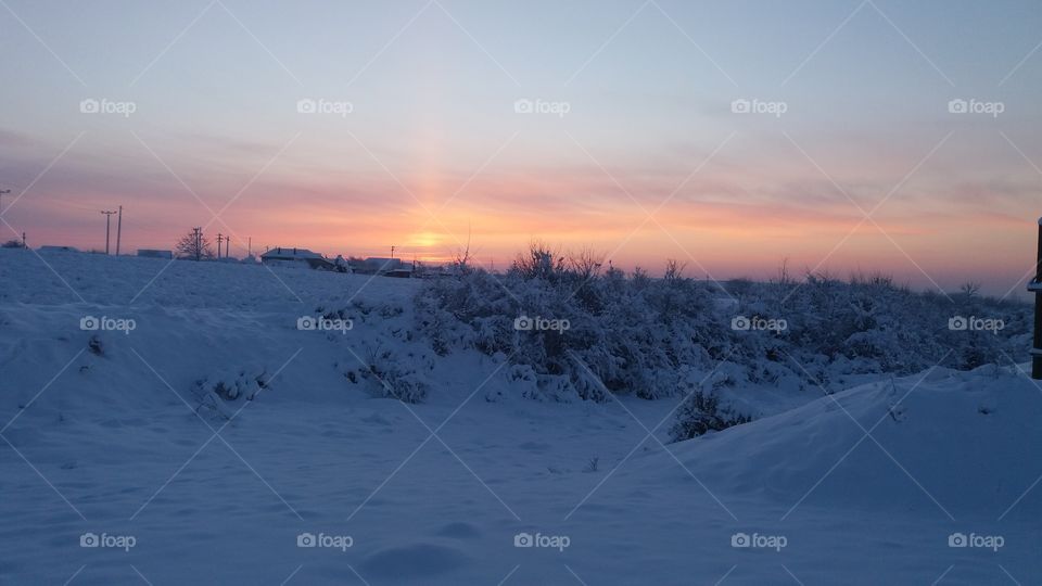 winter sunset over the town