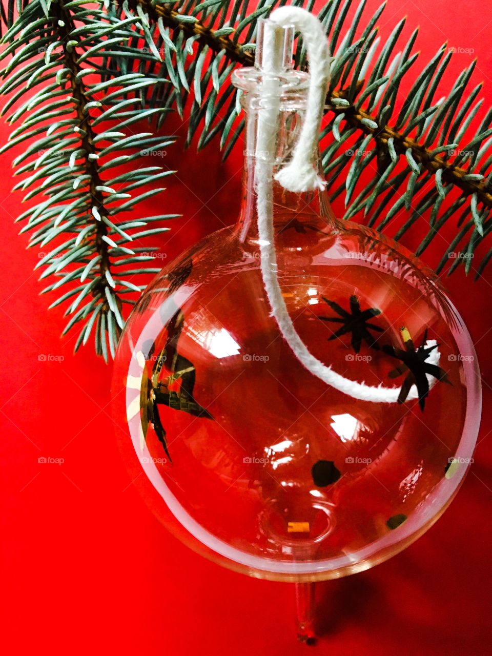 Glass bauble with wick waiting to be lit up for Christmas 