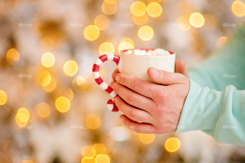 cup of coffee in a cozy festive Christmas atmosphere