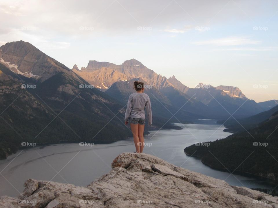 On Top of The World. Woman standing on mountain