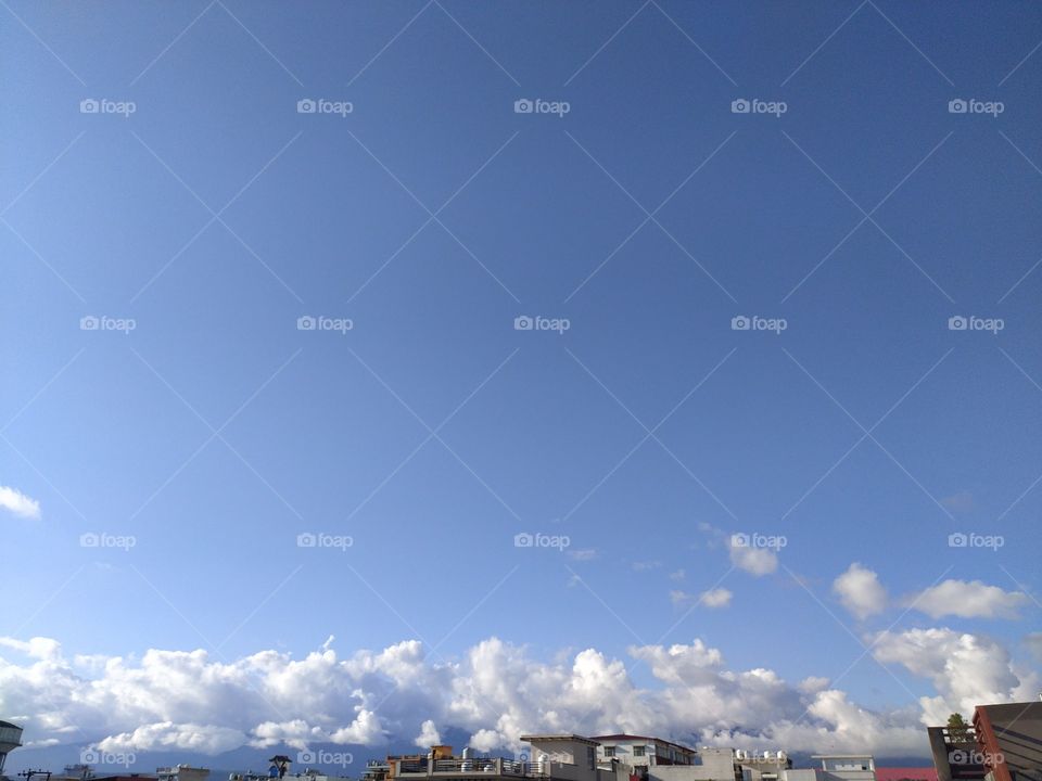 Pre monsoon clouds floating across the beautiful blue sky
