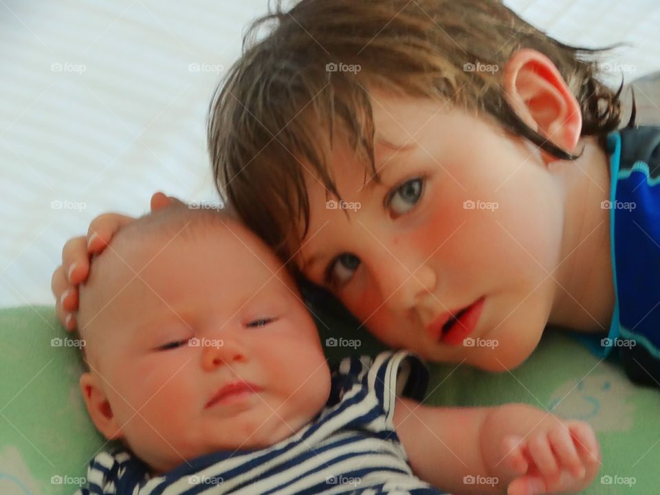 Portrait of a boy with his baby brother