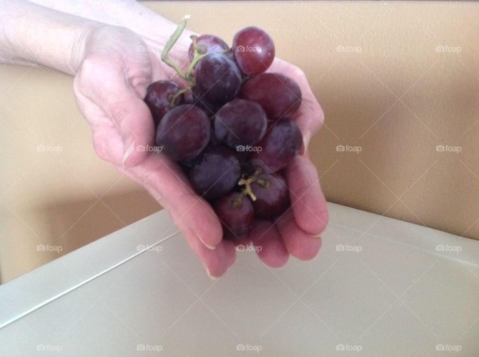 A handful of juicy red grapes.