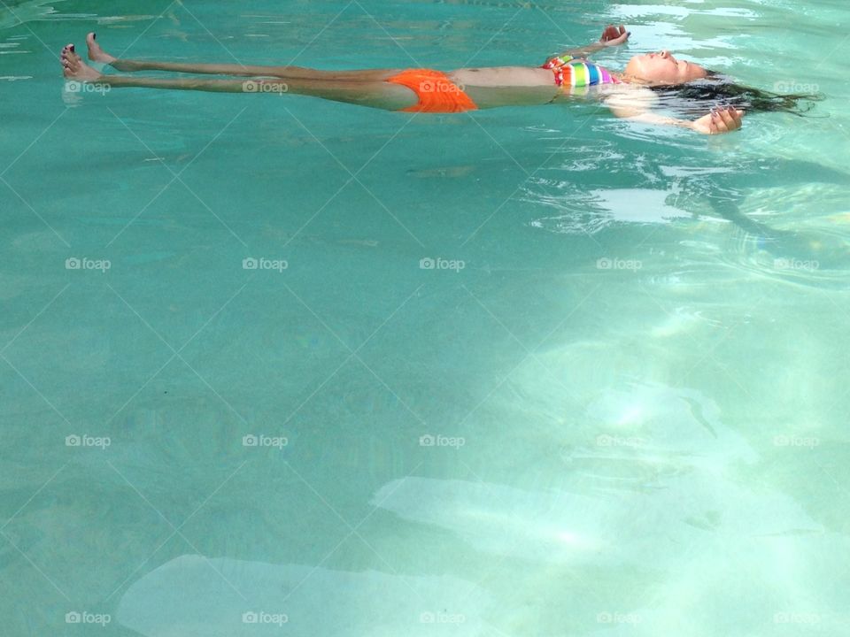 Floating in the pool