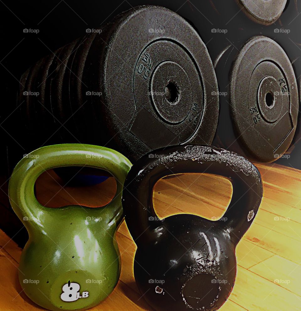 Working out at home with weights and kettle balls.