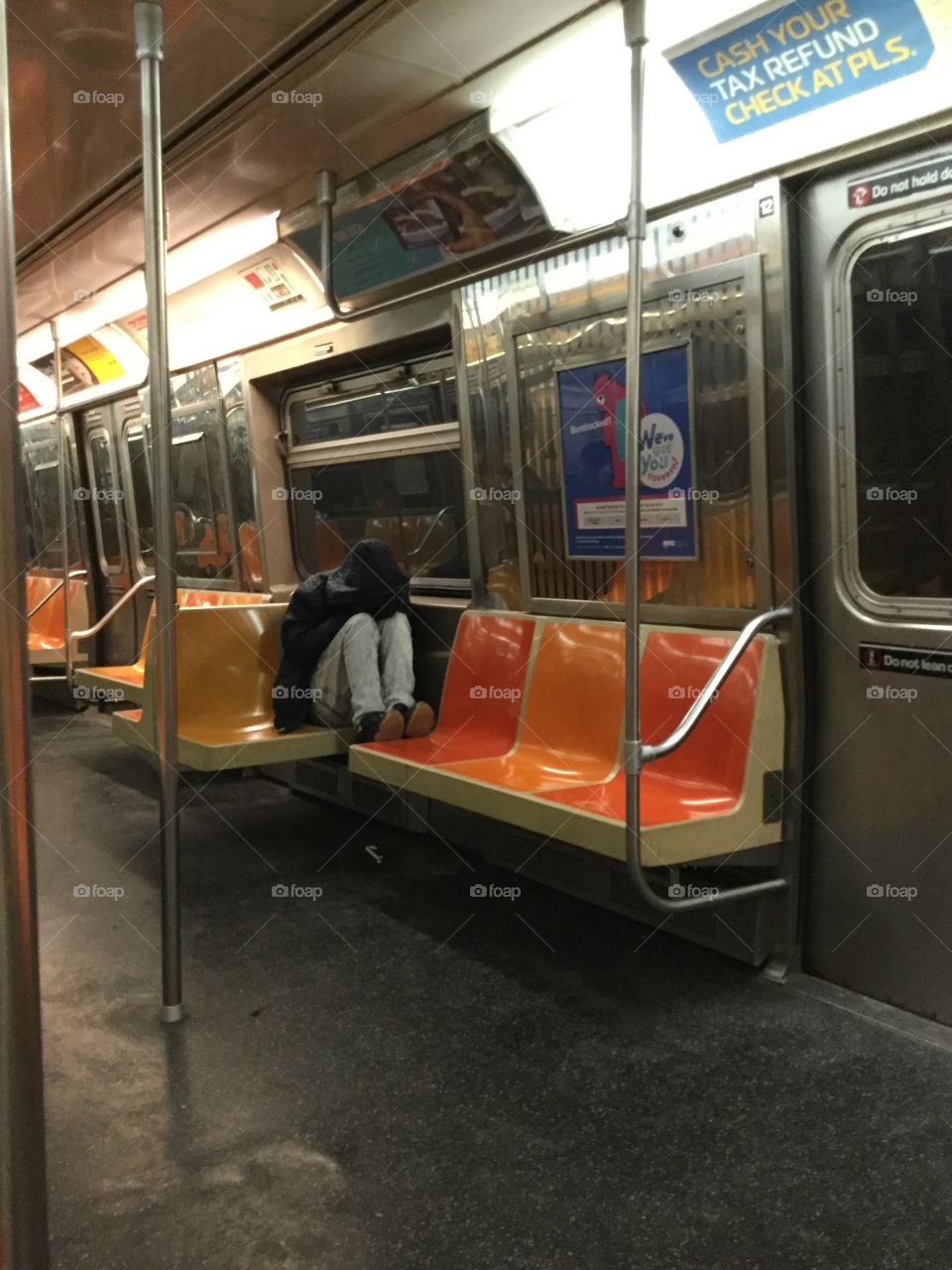 The lone  passenger, late at night on the G train.