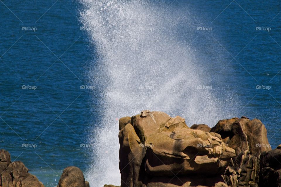 waves breaking on rocks
