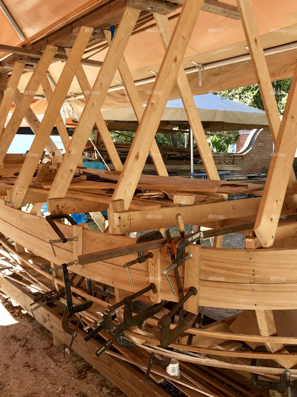Construction of a boat frame and bending wood with many clamps