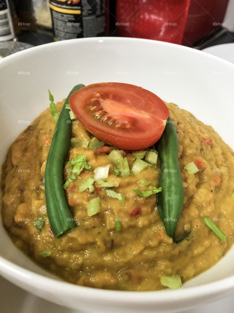 Ethnic style East Indian curried lentil
Soup topped with tomato and string bean