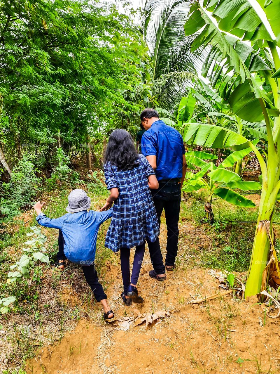 Father and Kids going for a long walk