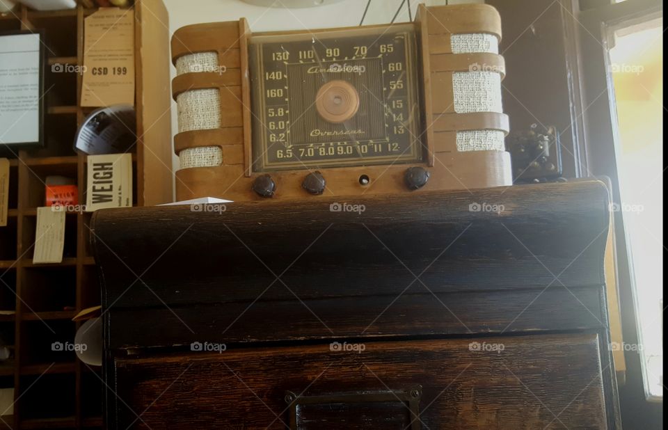 what would you do if your office radio didnt work back in the old days. This vintage display of a train station of yesteryear. Vintage radio on a vintage file cabinet.