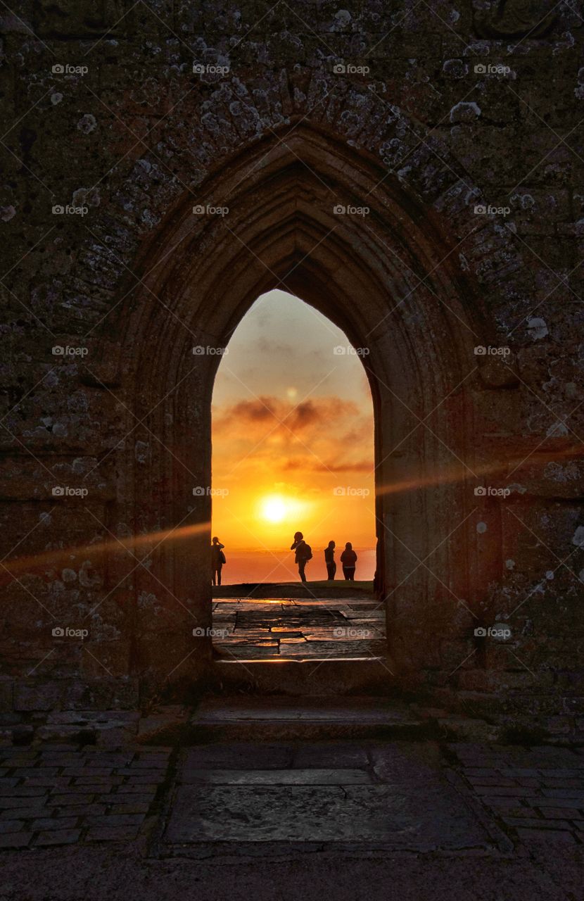 watching summer sunrise from the glastonbury tor in england