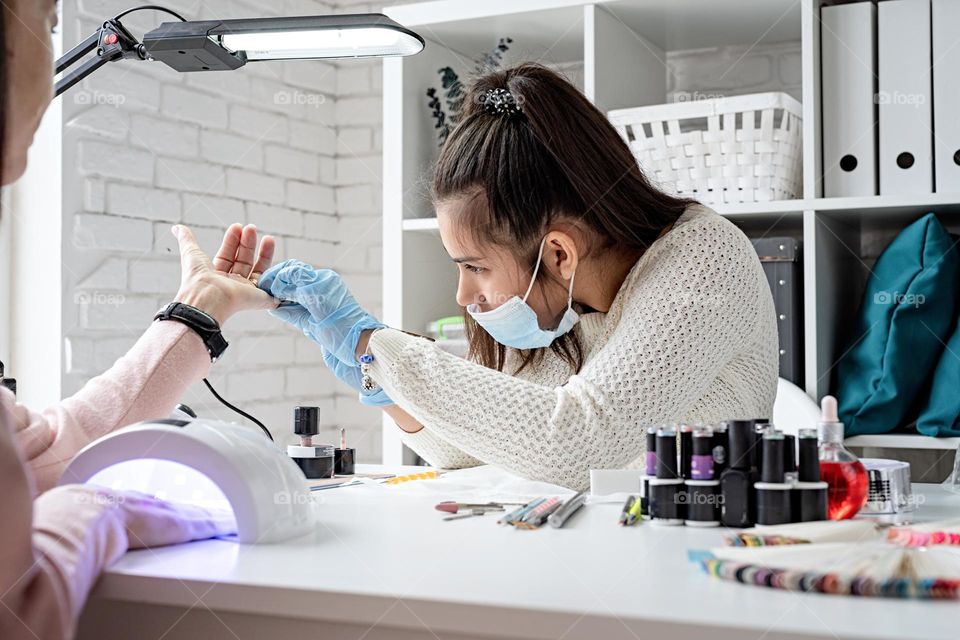 woman making manicure