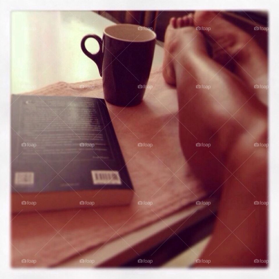 Relax with cup of coffee and book
