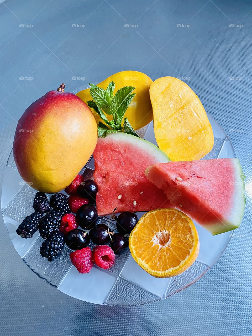 Delicious summer fruit plate sumptuous,colorful,healthy and yummy. 