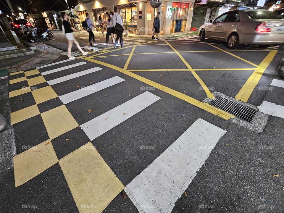 Zebra crossings on the road look like checkered cookie patterns