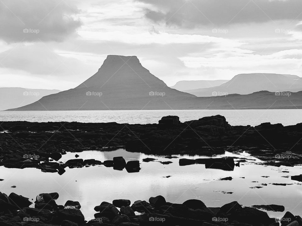 Black and white mountain reflection in pool