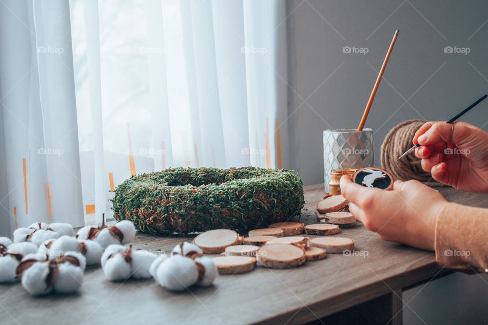 photo of a woman crafting an Easter wreath made only from eco friendly materials