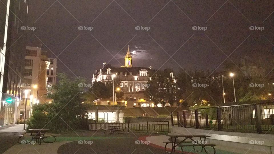1am in the morning , cloudy sky with the full moon hiding in it. #park #castle #outdoor #nightview #bench #table #trees #beautifulview