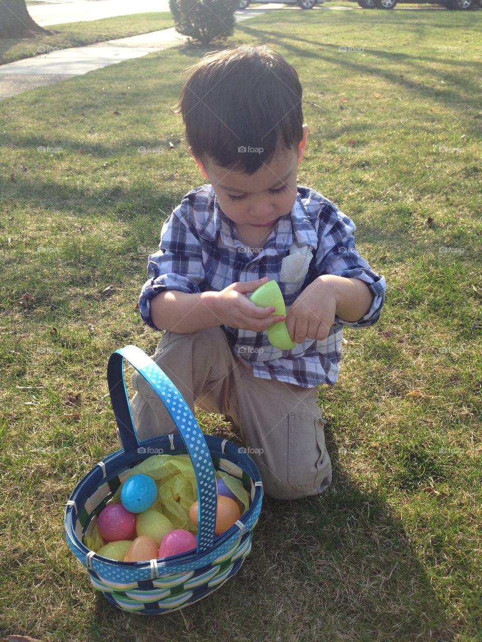 Easter Fun. Little boy with easter egg basket