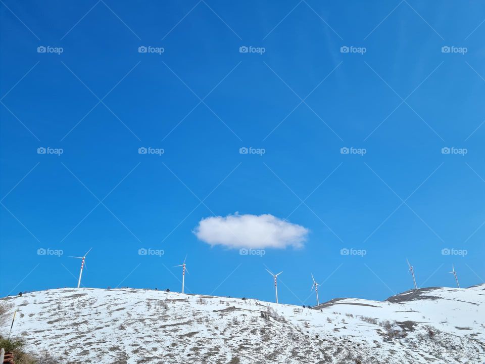 wind turbines on the snowy mountain