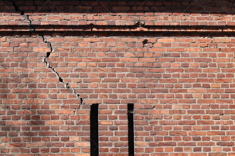 Old brick wall with crack