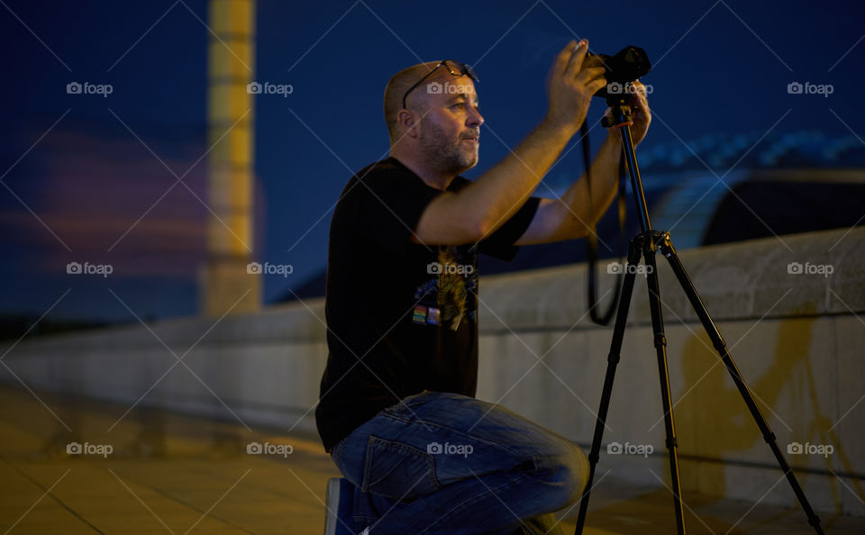 Close-up of a photographer photographing
