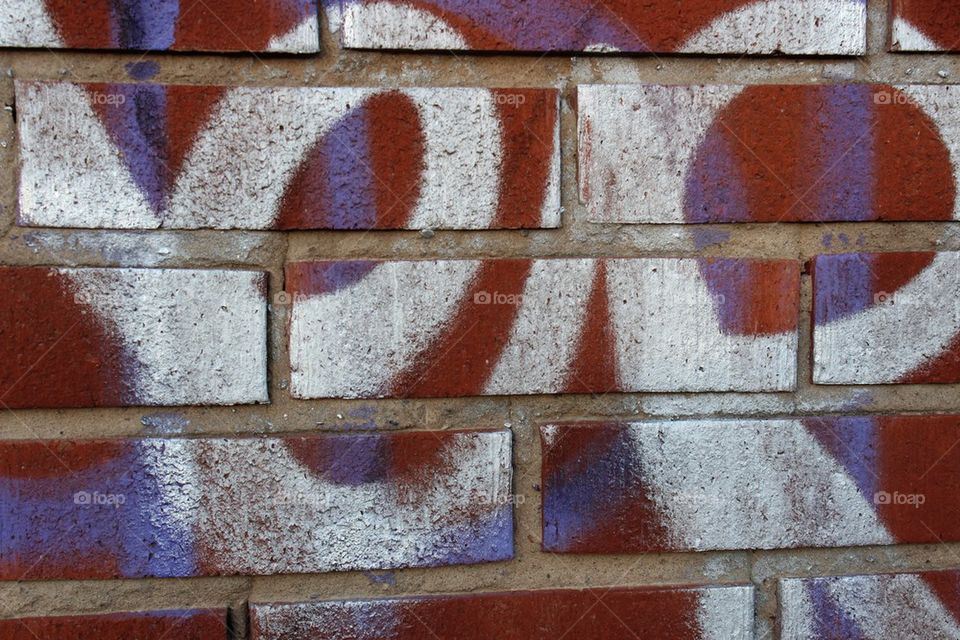 Graffiti on red brick wall