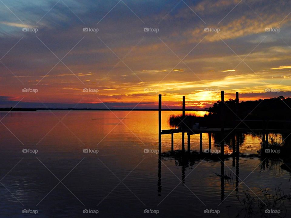 Liquid Gold - The water was glassy and calm, still candy-colored in the afterglow of golden and descending sunset
