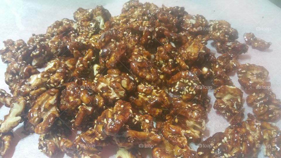 Caramelized and roasted walnuts with honey and sesame seed.
