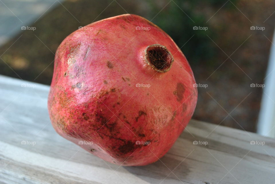 A pomegranate outside on the porch