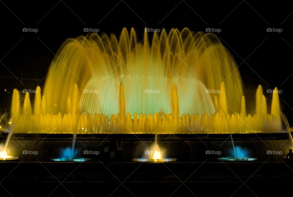 Fountain with yellow backlit in Barcelona