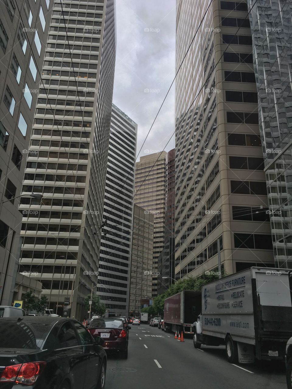 Downtown buildings so tall and overwhelming tower above us in San Francisco. 